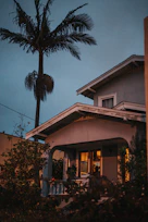 Cozy terrace house exterior bathed in warm evening light in Melaka.