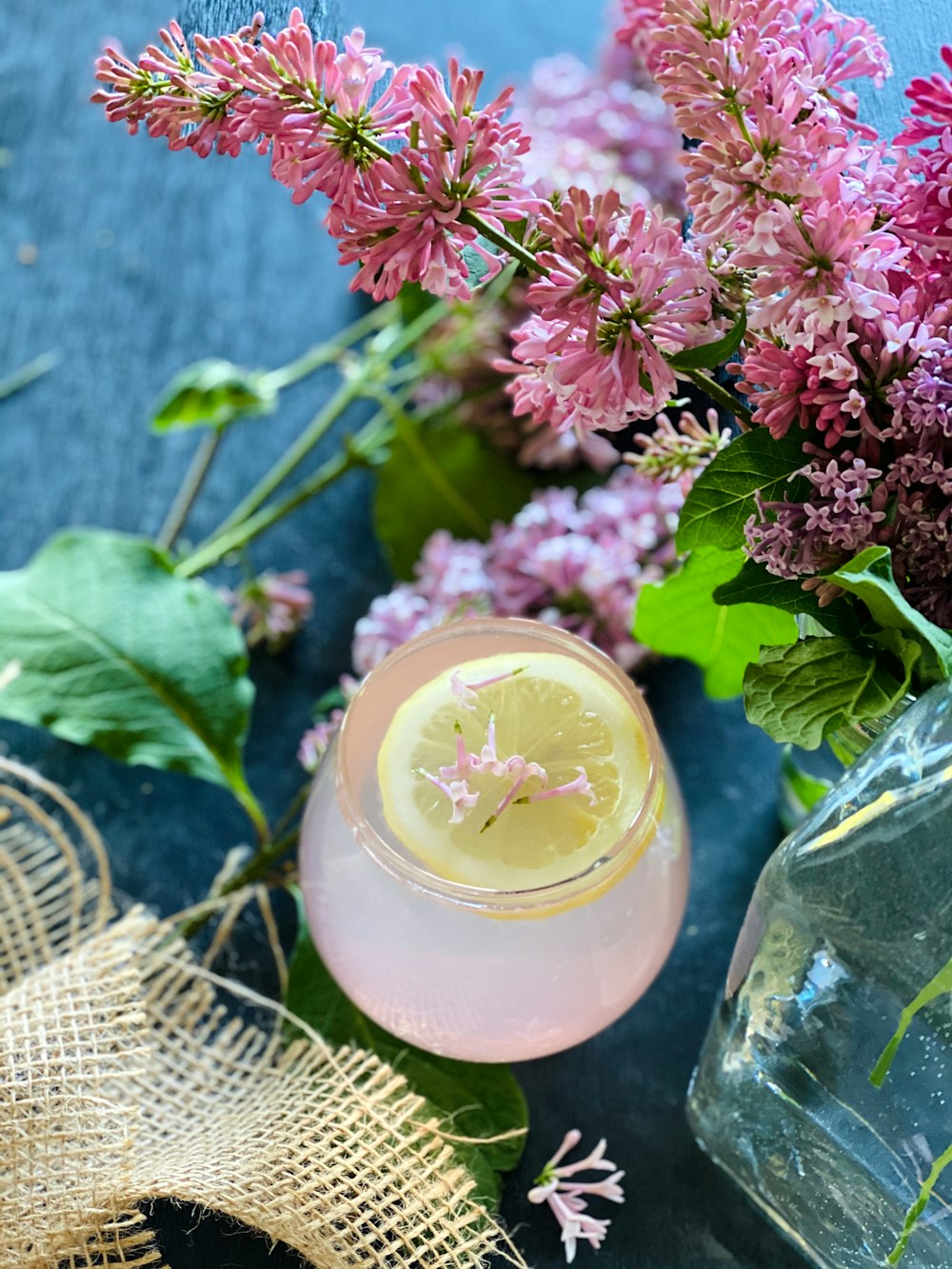 pink flowers in clear glass jar