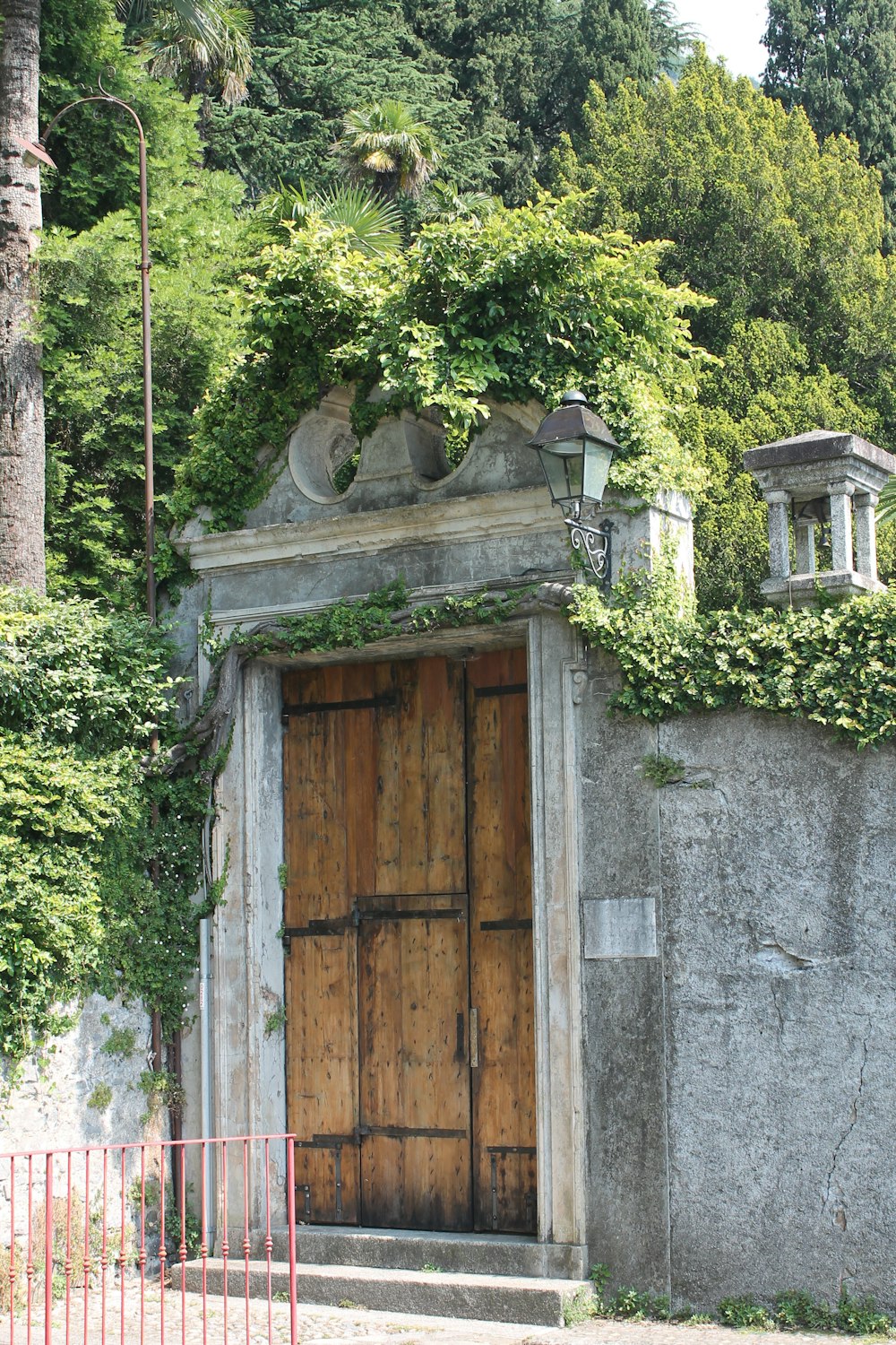 brown wooden door on gray concrete wall