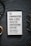 A book titled 'The Communication Book. 44 Ideas for Better Conversations Every Day' by Mikael Krogerus and Roman Tschäppeler is placed on a dark textured surface. There are headphones to the right and a cup on the left.