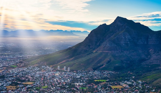 city near mountain under cloudy sky during daytime in Table Mountain National Park South Africa