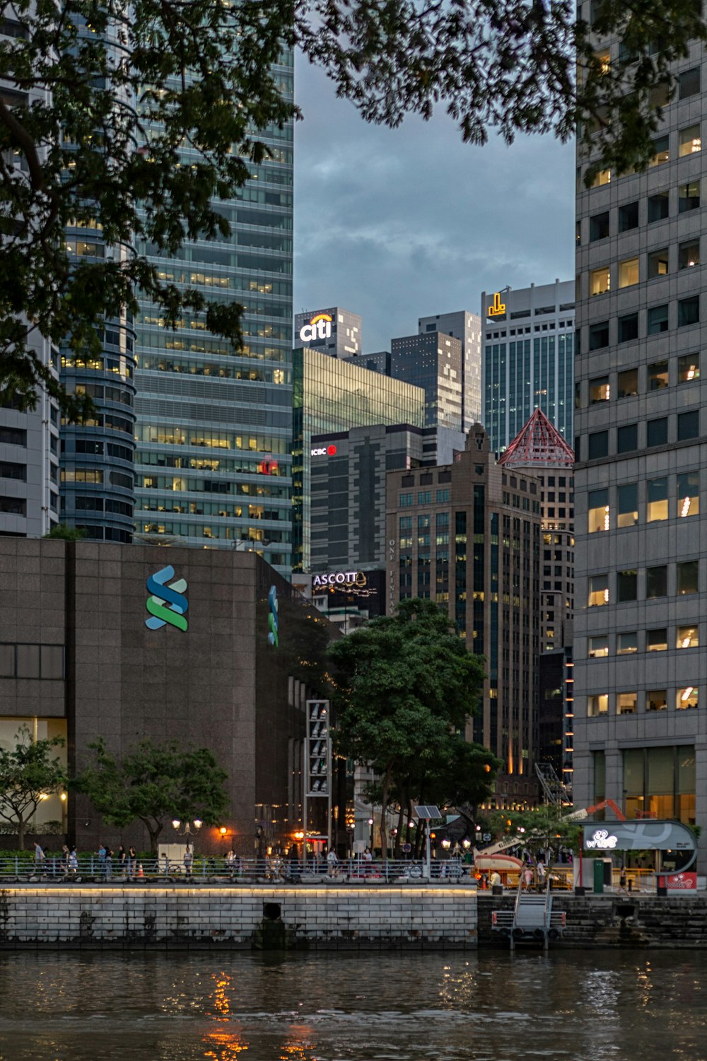 people walking on street near high rise buildings during daytime