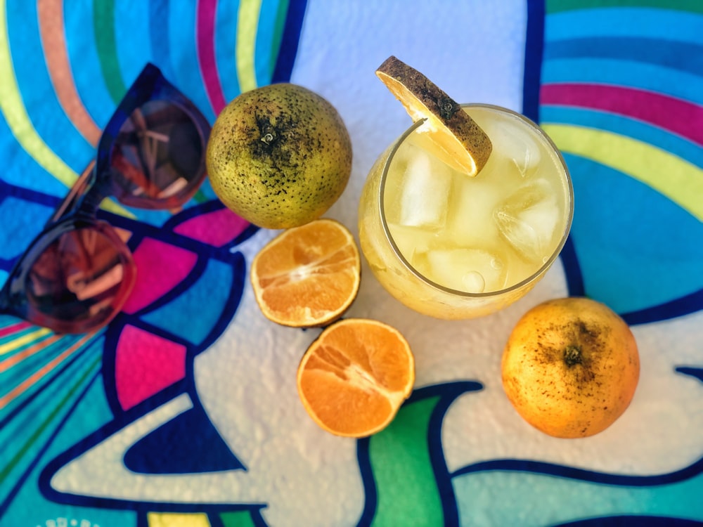 sliced lemon beside clear drinking glass