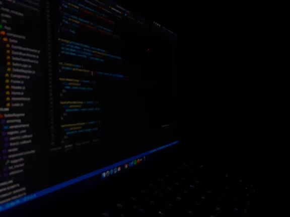 A close-up of a developer coding late into the night, reflecting dedication behind Modenic Solutions' products.