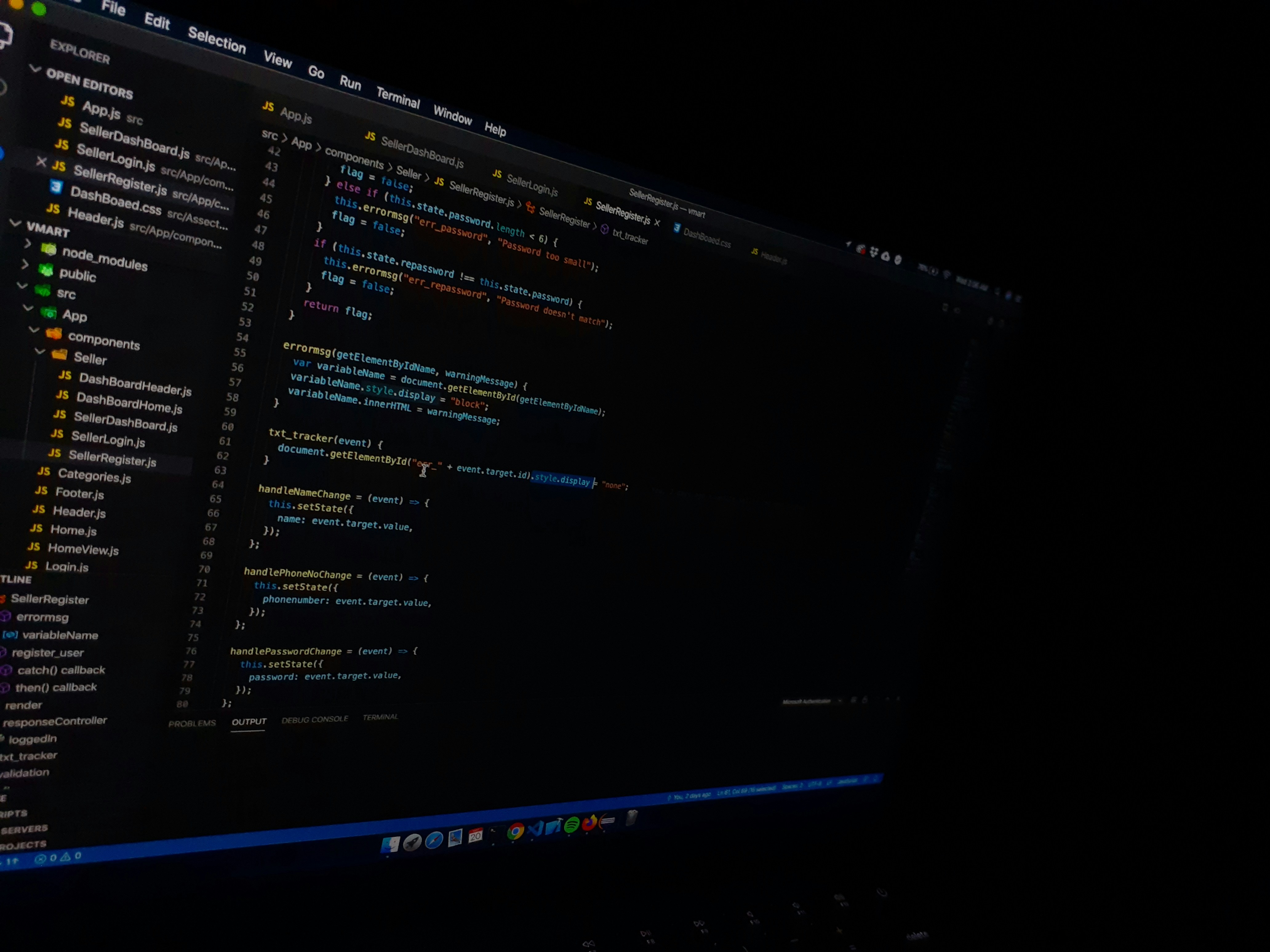 A computer screen displaying a code editor with visible syntax highlighting. The editor shows various files listed on the left panel and a JavaScript file open with lines of code visible. The environment appears to be a dark-themed setting.
