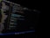 A computer screen displaying a code editor with visible syntax highlighting. The editor shows various files listed on the left panel and a JavaScript file open with lines of code visible. The environment appears to be a dark-themed setting.