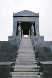 gray concrete stairs with gray concrete railings