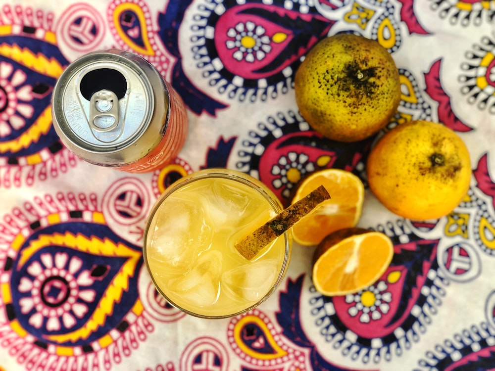 yellow fruit on white and pink floral table cloth