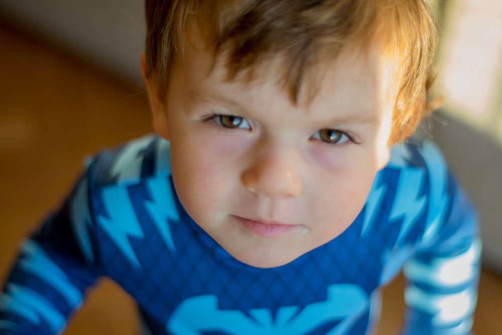 boy in blue and white striped crew neck t-shirt