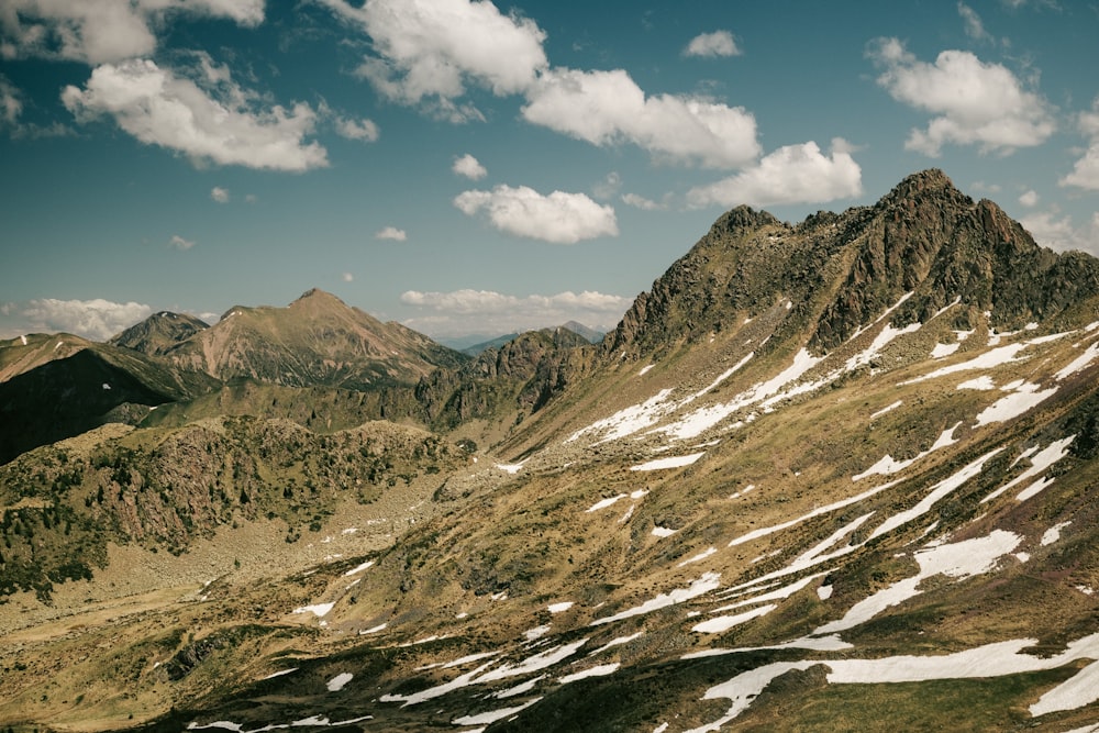 brown and white mountains under blue sky during daytime