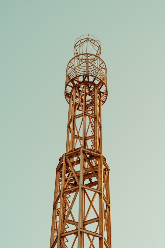 brown metal tower under blue sky during daytime in Ahvaz Iran