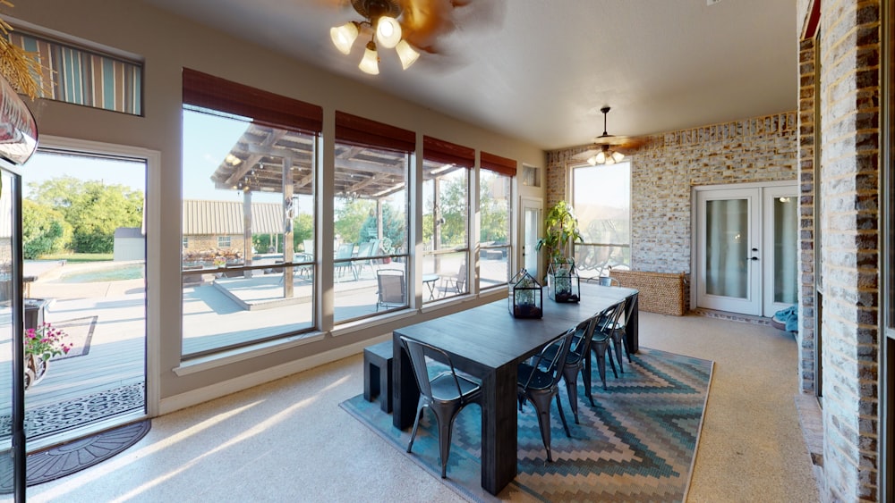 black wooden table near glass window