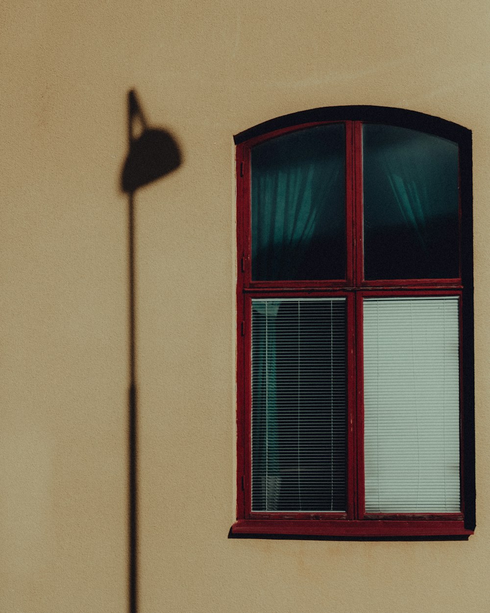 red wooden framed glass window