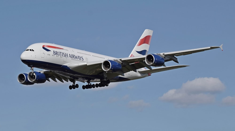 a large jetliner flying through a blue sky