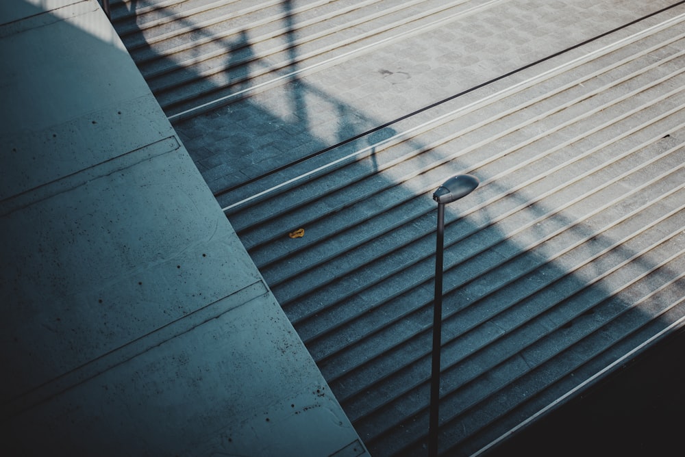 white metal fence on gray concrete floor