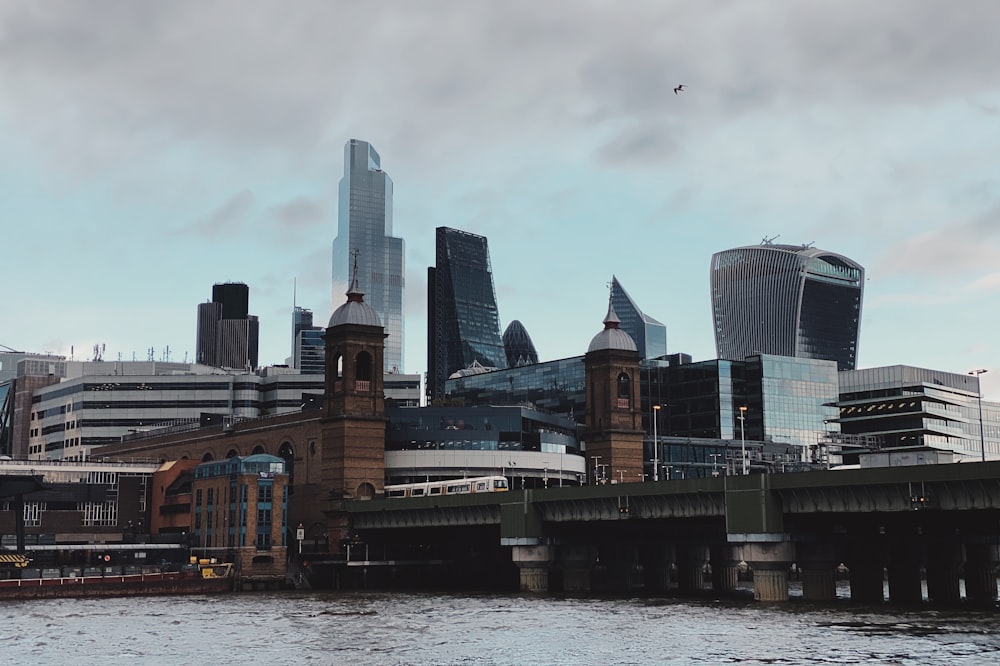 city buildings near body of water during daytime