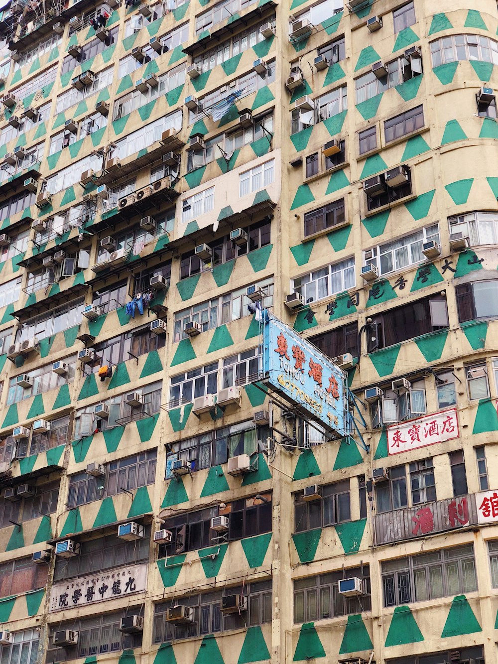 brown and green concrete building during daytime