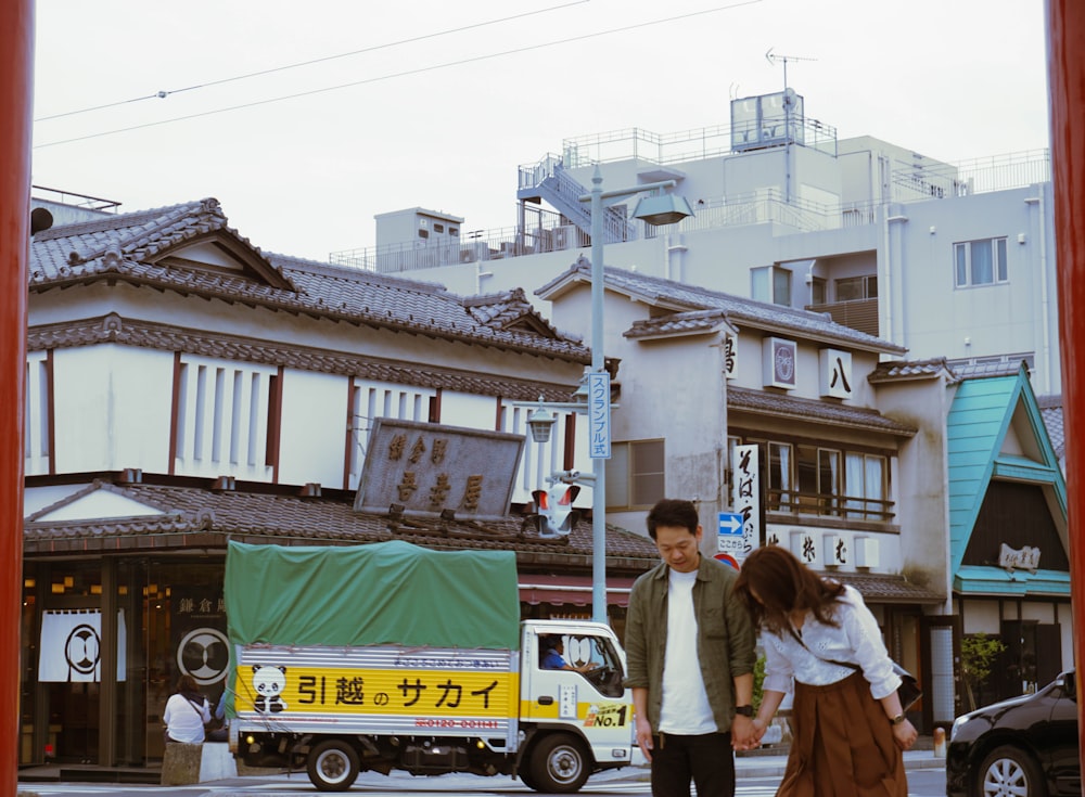 man in white shirt standing beside woman in white shirt