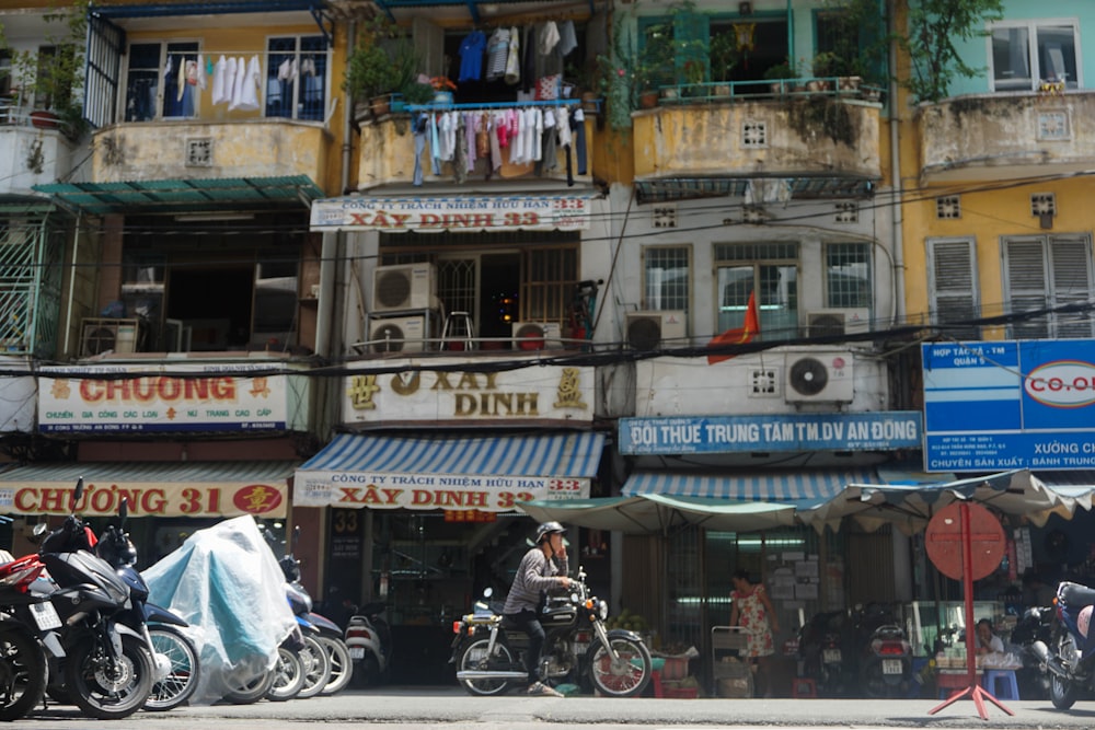 people riding motorcycle on street during daytime