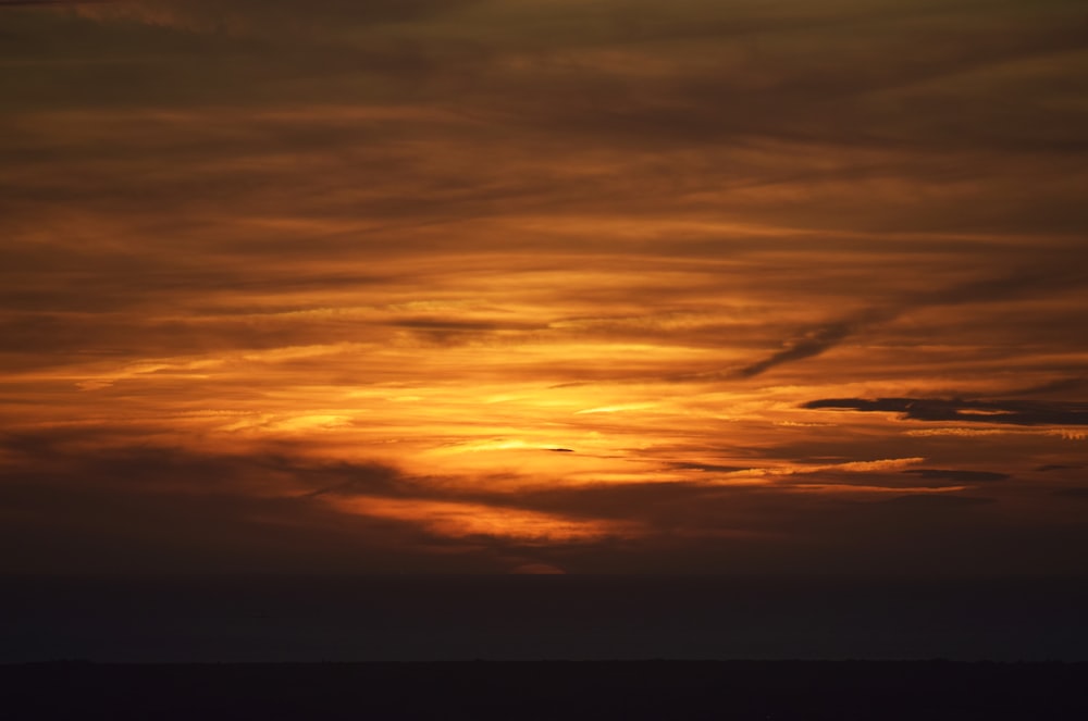 orange and grey clouds during sunset