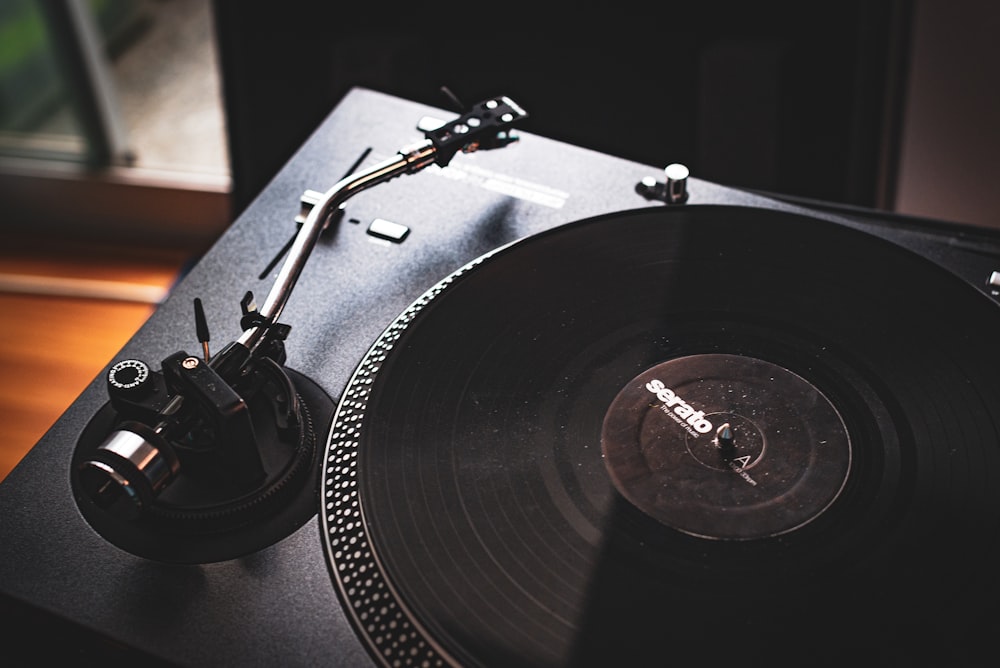 black vinyl record player on black vinyl record player