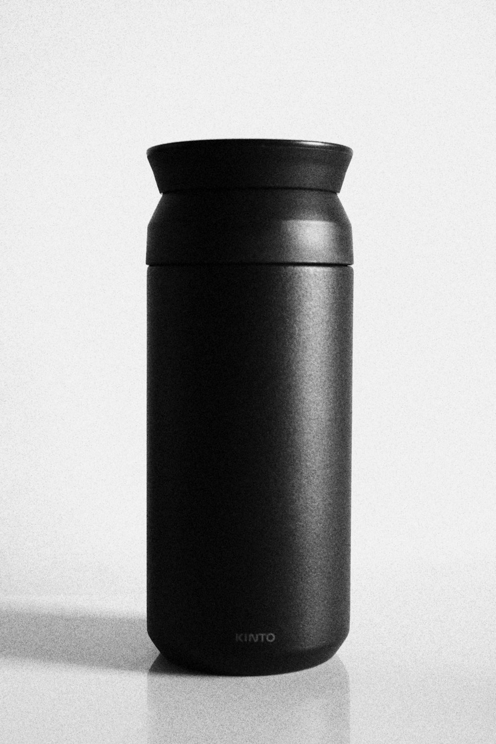 black steel tube on white surface