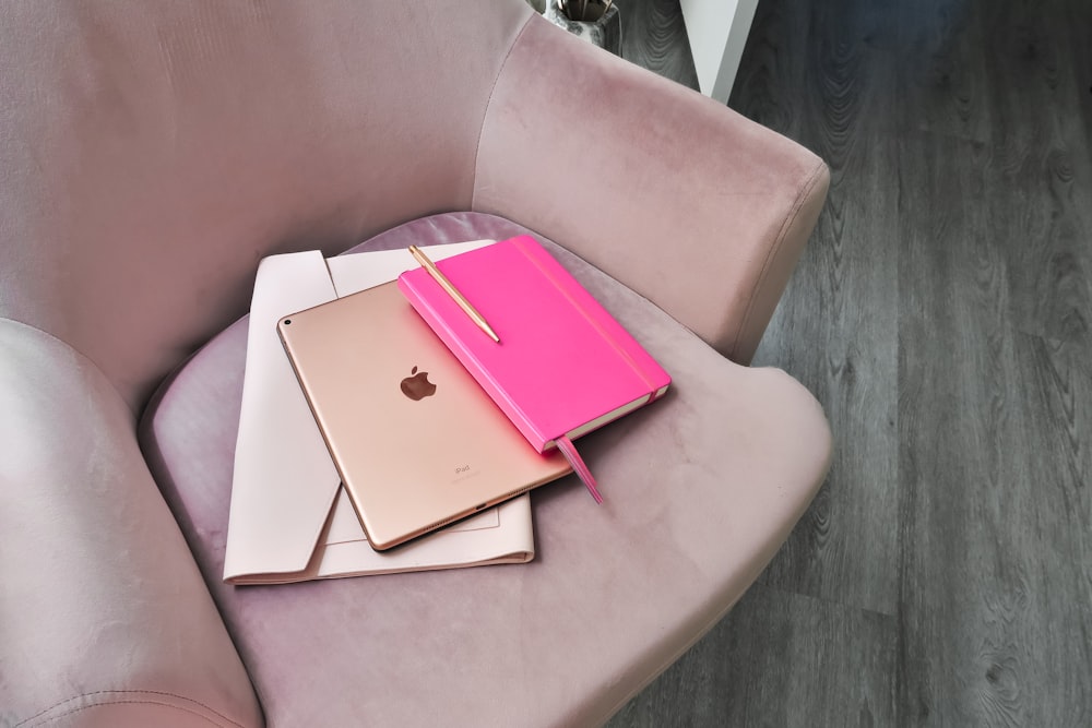 pink tablet computer case on pink chair