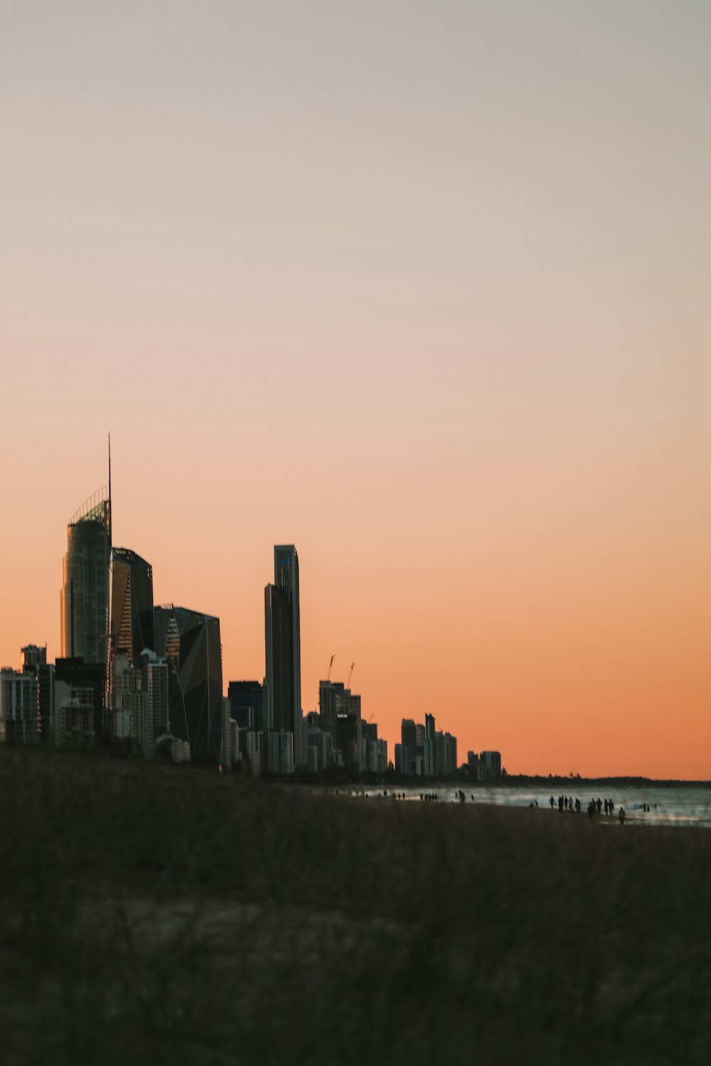 city skyline during orange sunset