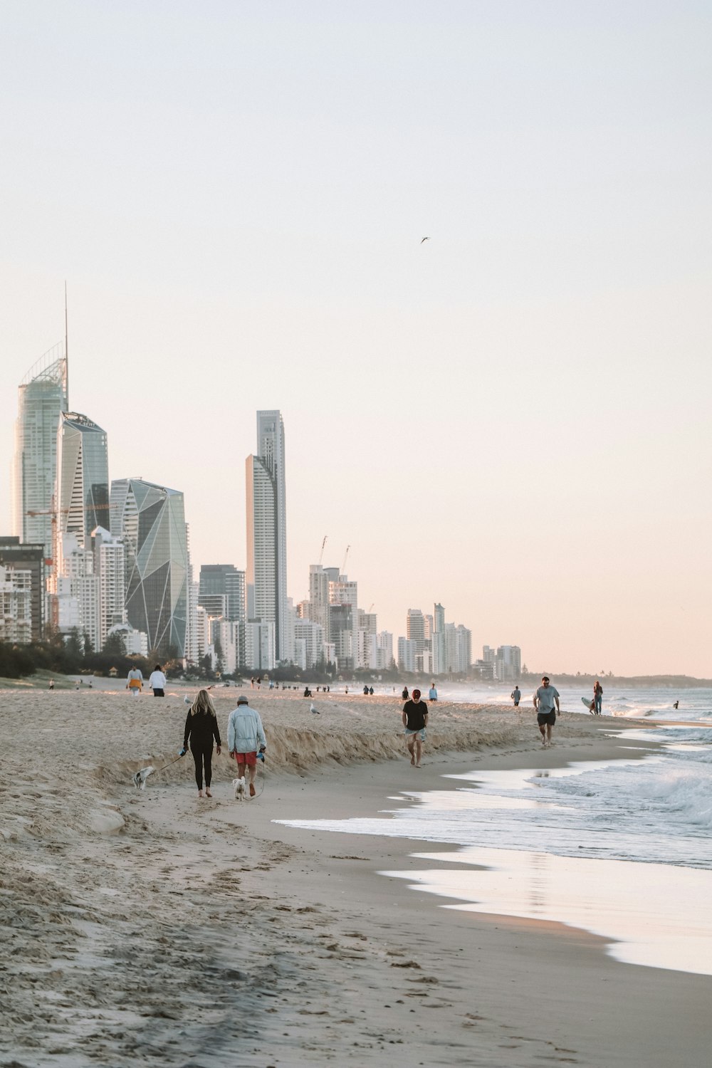 people walking on beach during daytime