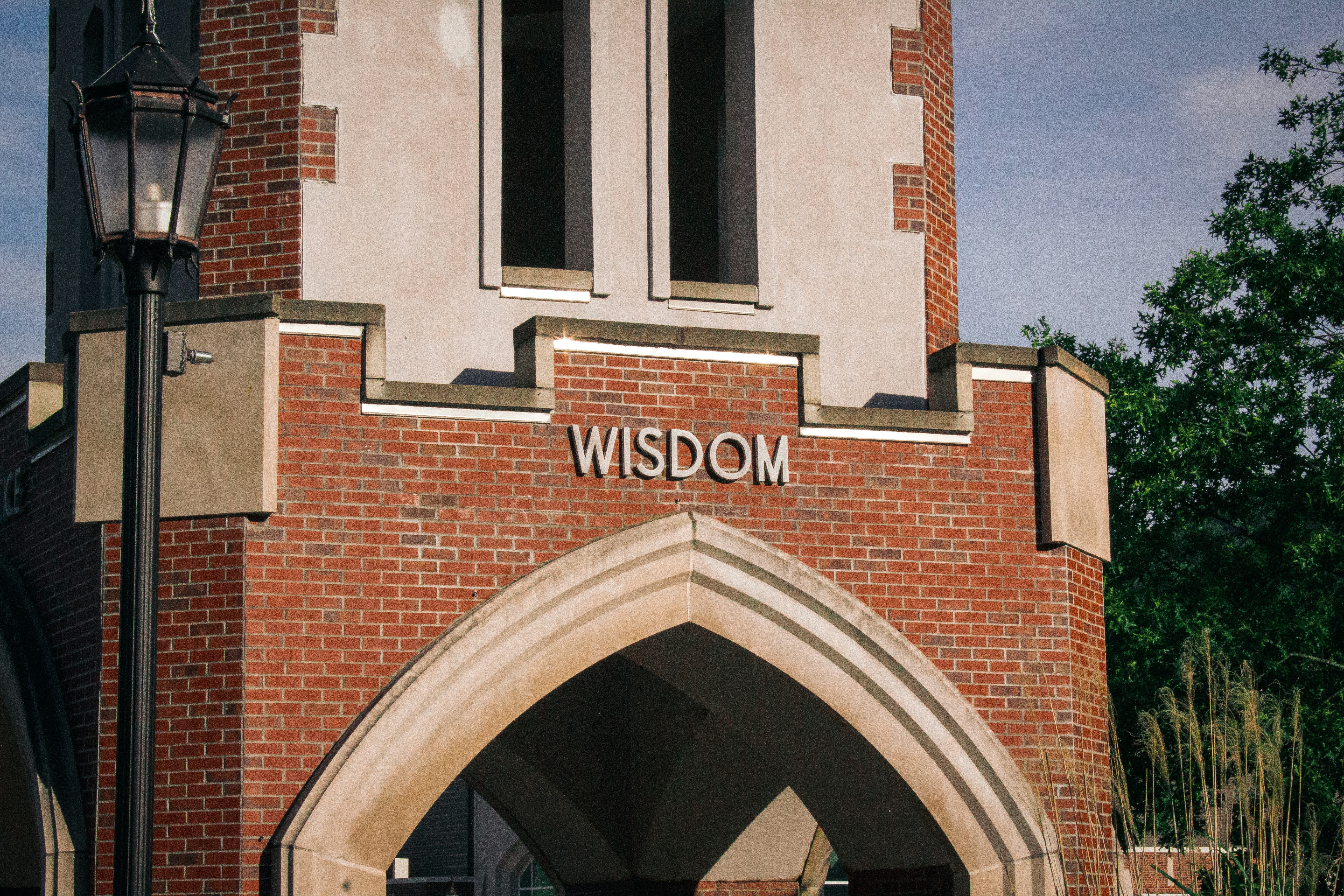brown brick building with glass window