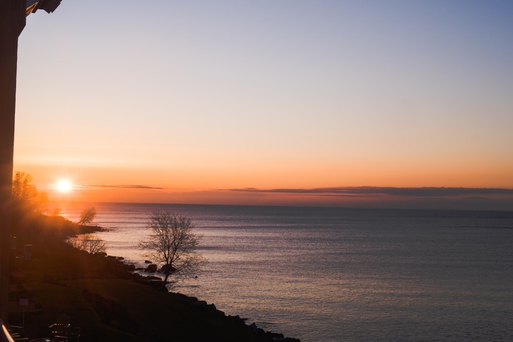 body of water during sunset