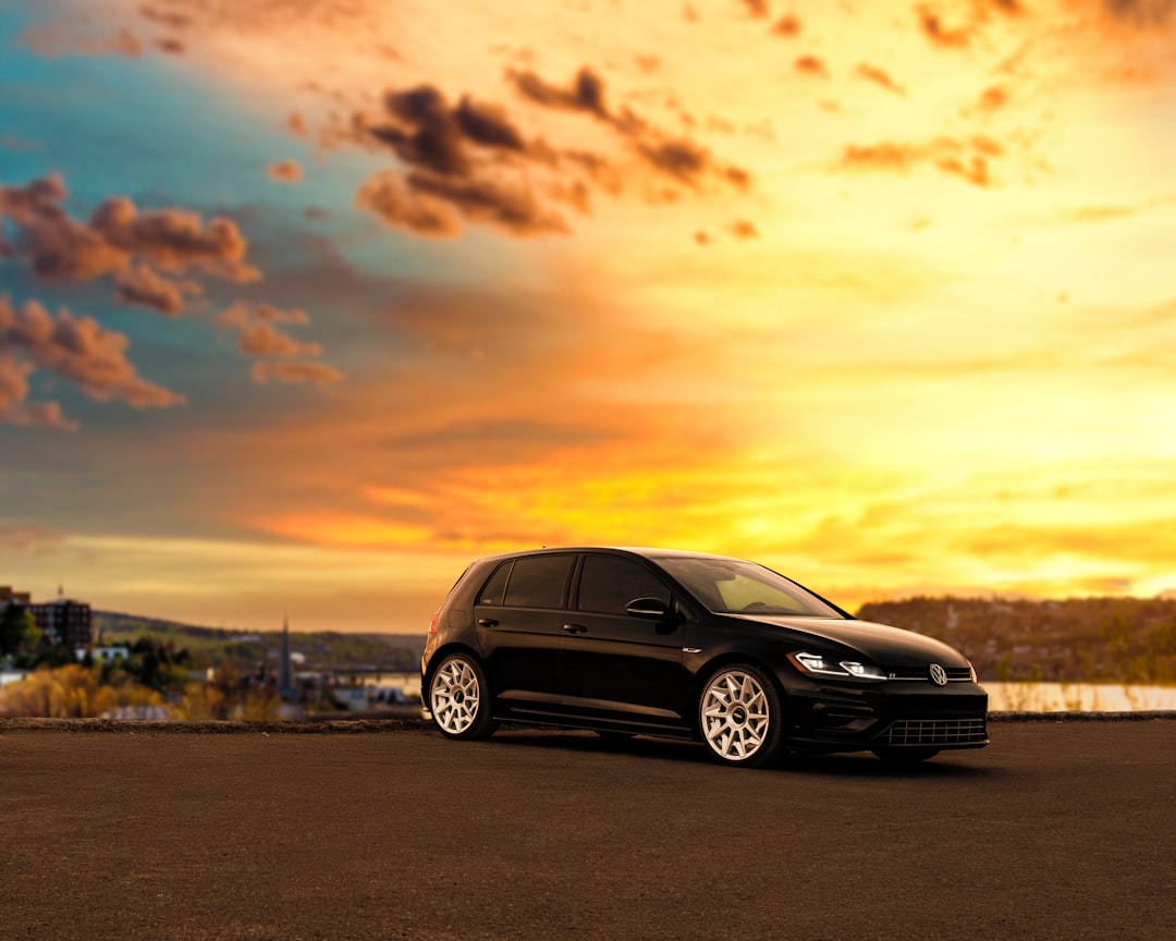 black mercedes benz c class on road during sunset