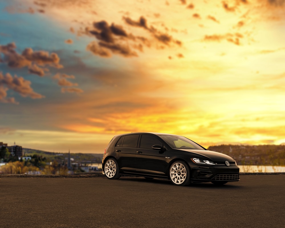 black mercedes benz c class on road during sunset