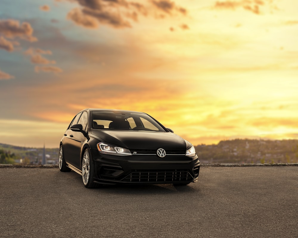 black mercedes benz c class on gray asphalt road during sunset