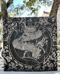 A vibrant, hand-sketched dragon curling around ancient runes on parchment.