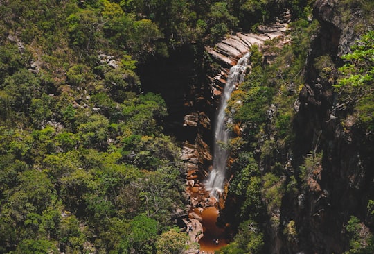 waterfalls in the middle of green trees in Chapada Diamantina Brasil