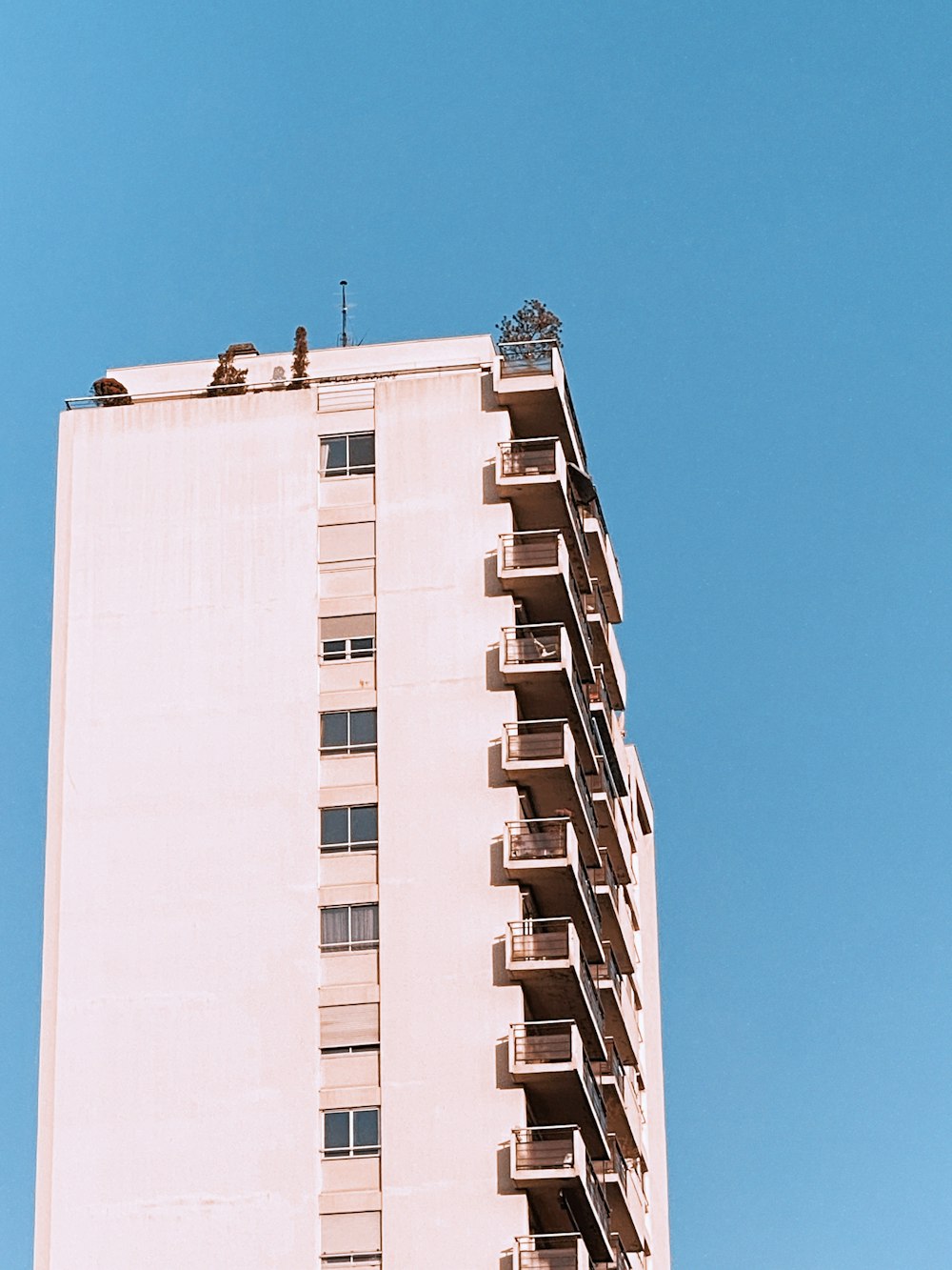 white concrete building under blue sky during daytime