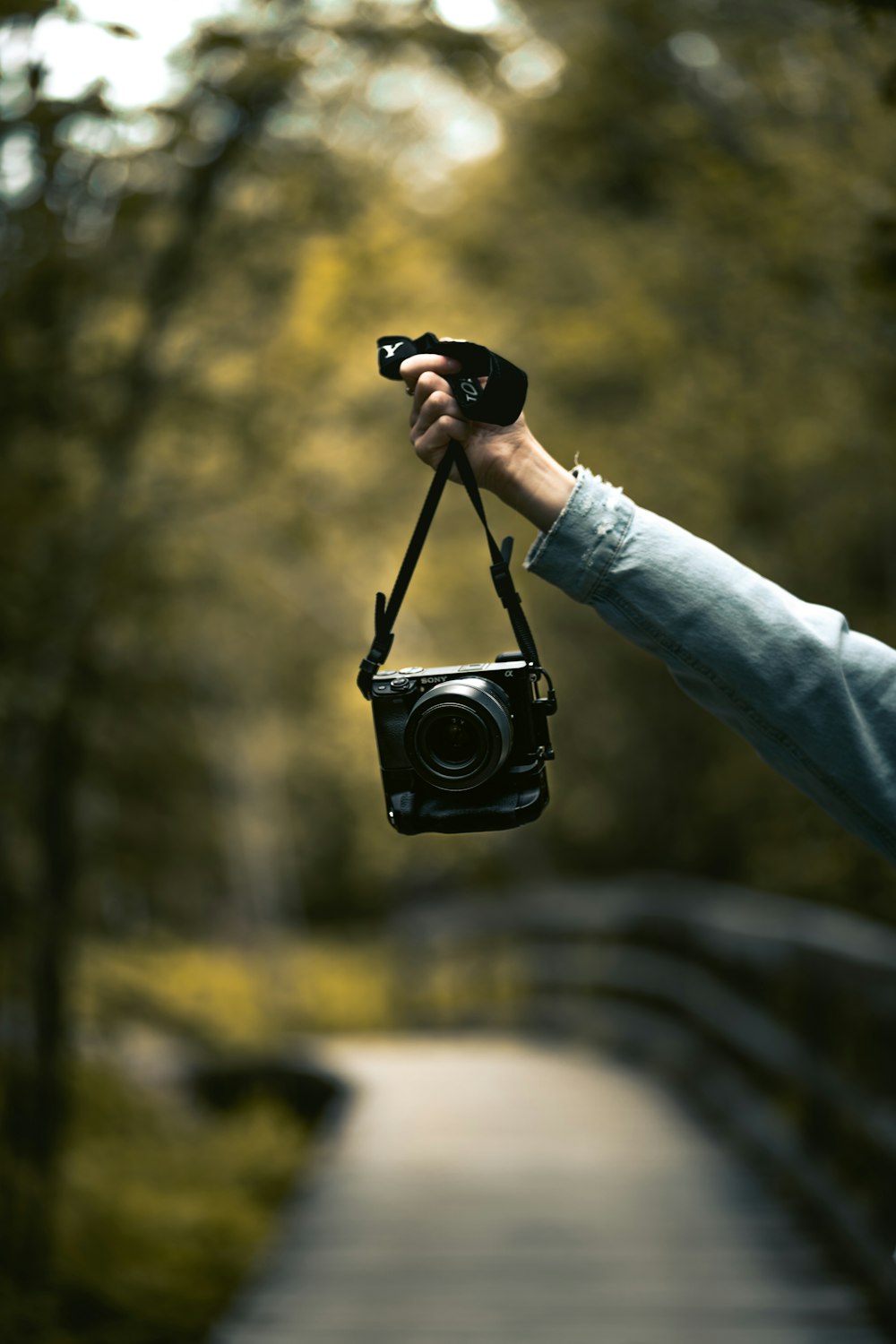 person holding black dslr camera