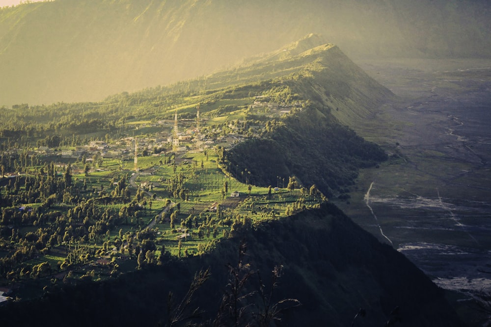 aerial view of city buildings near mountain during daytime