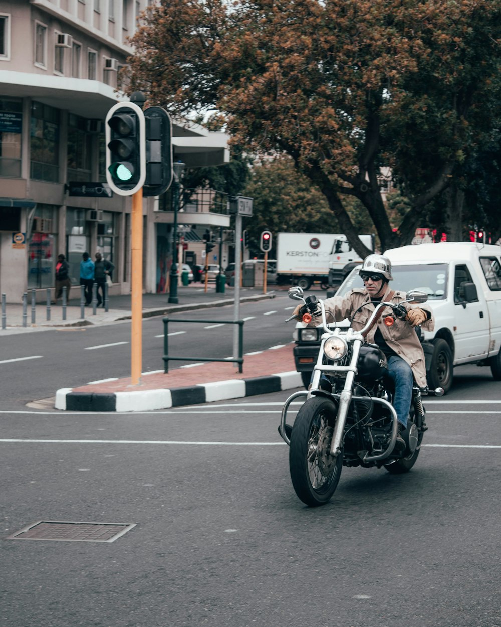 man in black jacket riding motorcycle on road during daytime