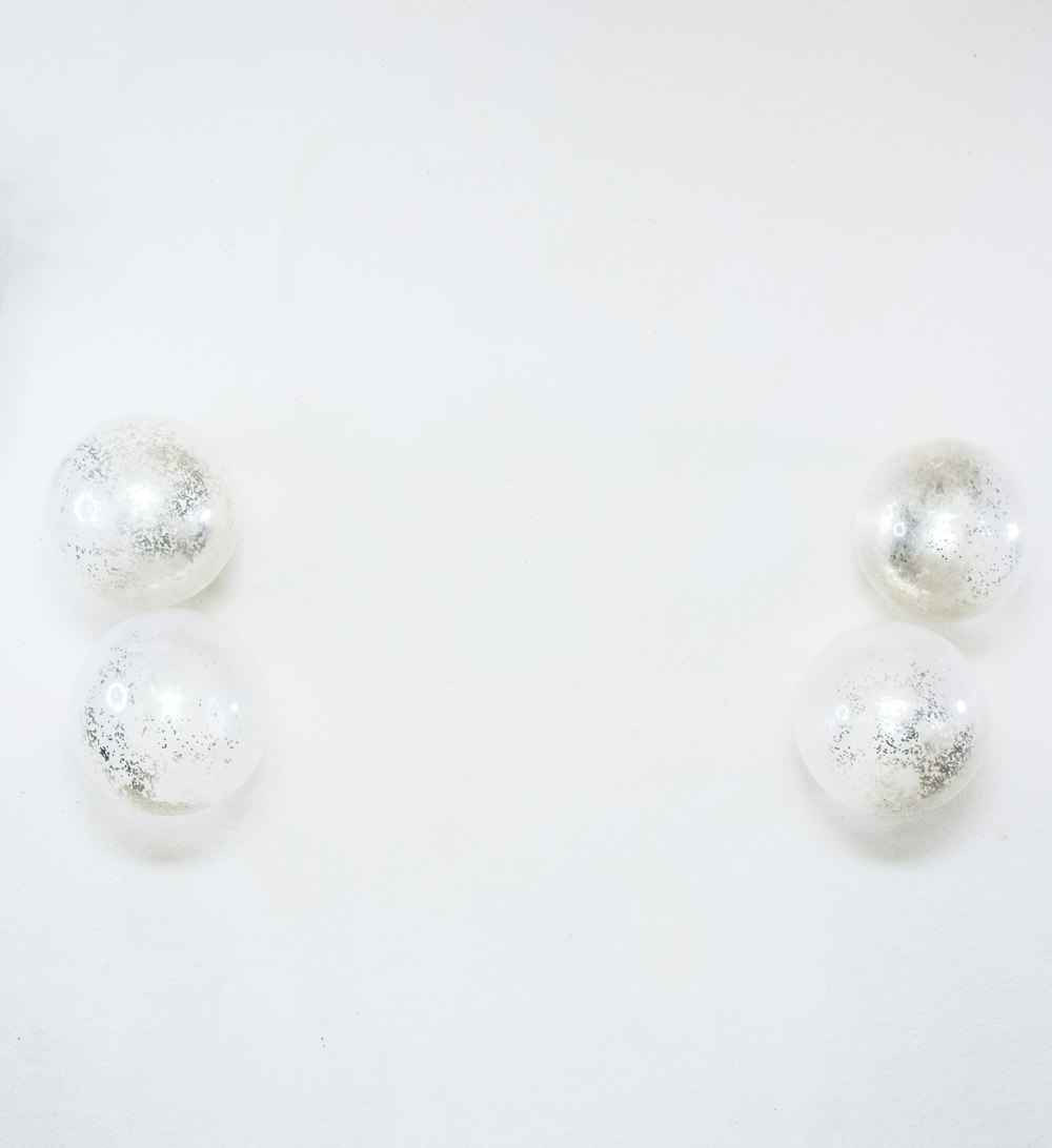 white pearl beads on white surface