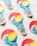 Several stickers shaped like light bulbs are arranged on a light surface. Each sticker features an artistic design of a wave overlaid on a sunset with vibrant colors. The top half showcases a red and yellow gradient resembling a sunset, while the bottom half displays a stylized blue wave.