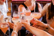 woman in black tank top holding clear wine glass