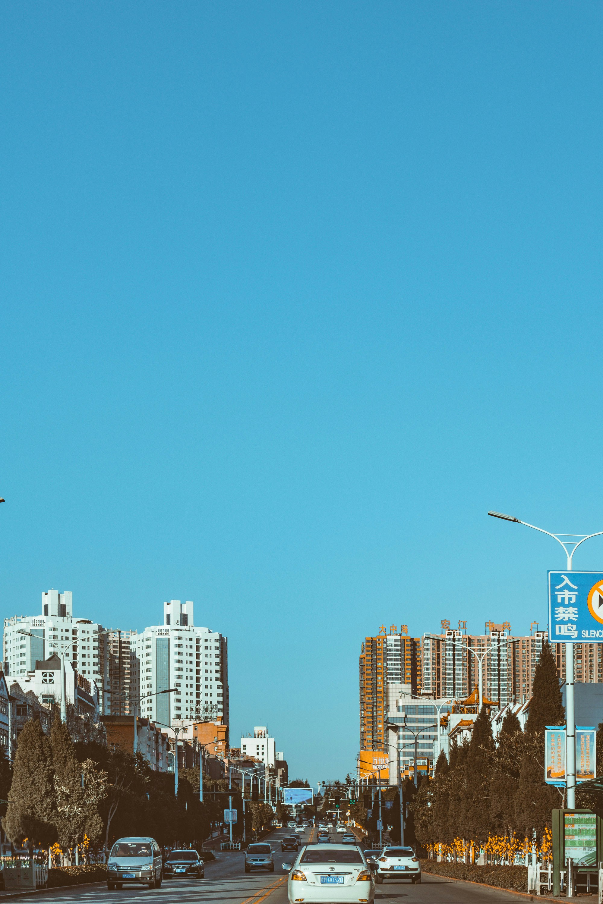 city skyline under blue sky during daytime
