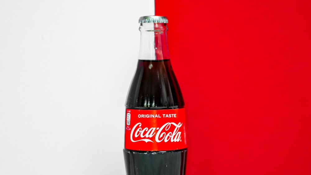 coca cola bottle on white table