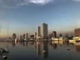 city skyline across body of water during daytime
