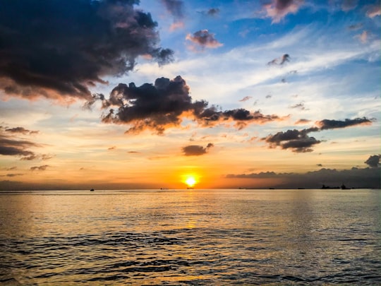 body of water under cloudy sky during sunset in Manila Philippines