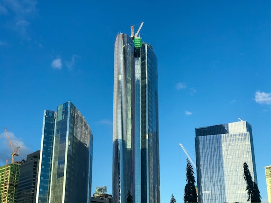 high rise building under blue sky during daytime in Makati City Philippines