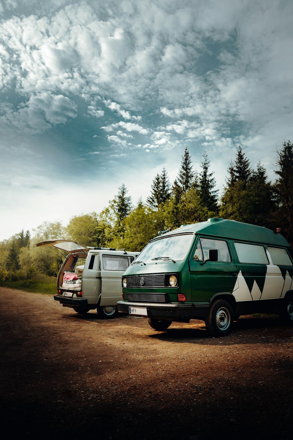 green and white van on road during daytime