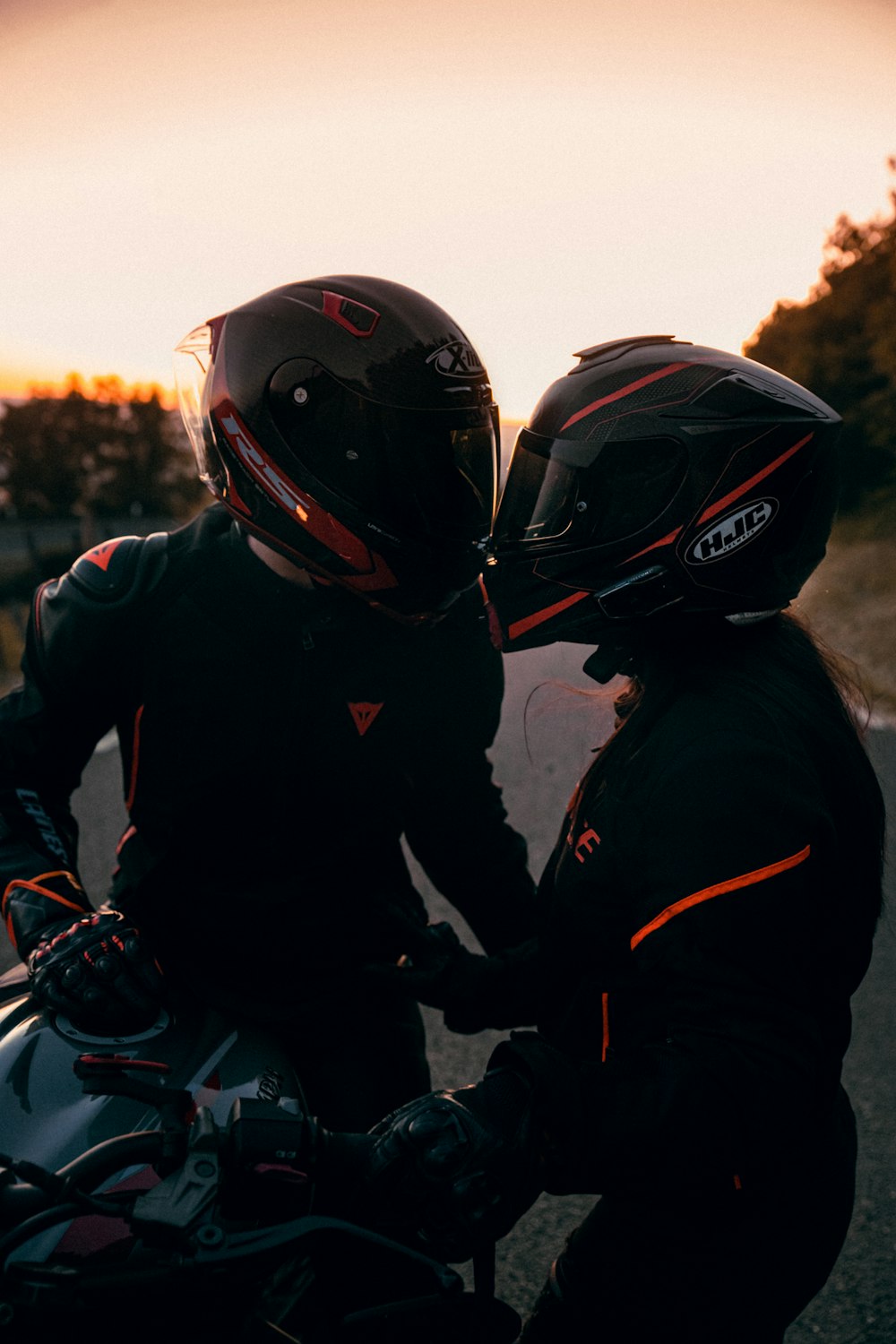 man in black and red jacket wearing black helmet